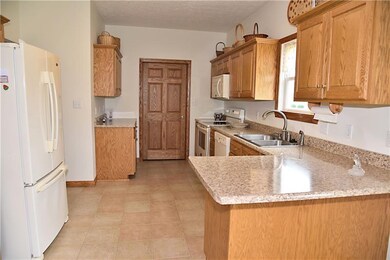 The Eat-in Kitchen is complete with all the kitche