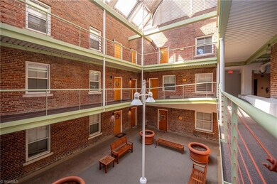 Atrium - trees are being added to the large containers
