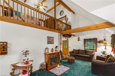 View of the loft and living room with electric fir
