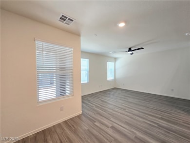Empty room featuring wood finished floors, baseboa