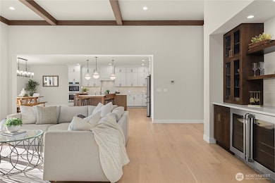 On the right is the entertaining Beverage wall in the Great room complete with Double Beverage Cooler in the Base Cabinets.