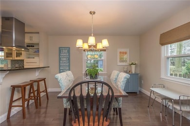 The dining room is open to the kitchen contributin