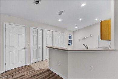 Kitchen featuring light wood finished floors, a pe