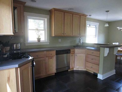Kitchen. Lovely ceramic tile floor and stainless a