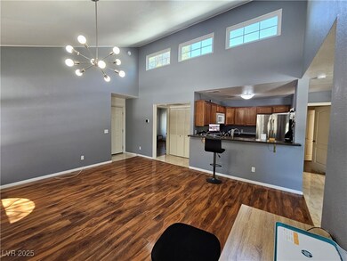 Unfurnished living room with a notable chandelier,