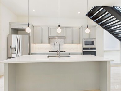 Kitchen with stainless steel appliances, tasteful