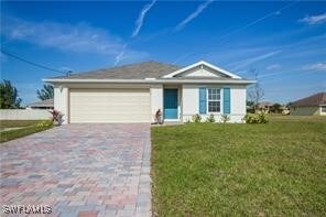 View of front of house featuring driveway, a garag