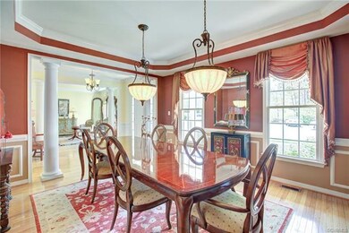 Featuring tray ceiling, chair and picture moldings