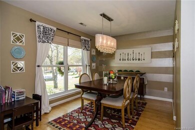 Your formal dining room with exquisite light fixture sure to turn heads.