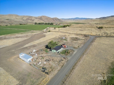 Aerial view of sparsely populated area featuring a mountainous background