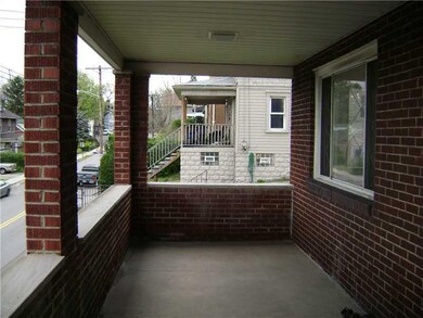 Exterior Front. Large front porch overlooking Rive