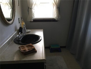 Full bath has a tub/shower and granite vanity.