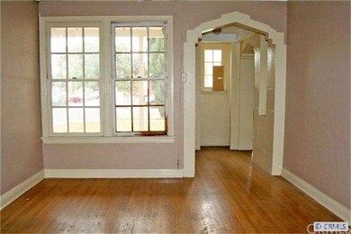 Formal dining room has windows to covered porch an