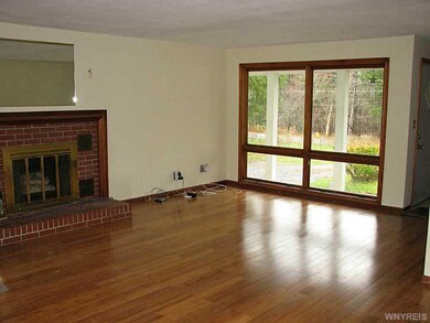 Living Room. Large living room is gas insert WBFP.