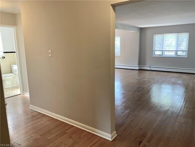 Entrance to unit with beautiful hardwood floors