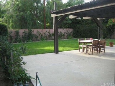Large patio area with a patio cover.