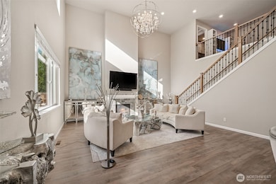 Gas fireplace & stunning chandelier in the great room