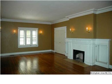 LIVING ROOM W HARDWOOD FLOORS, FIREPLACE, & CROWN 