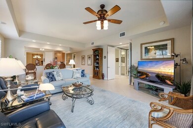 Living room with a ceiling fan, visible vents, rec