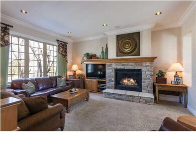 Hearth room looks out over wooded lot