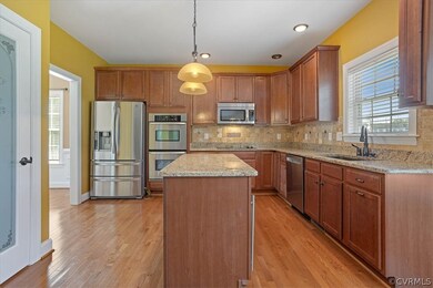 What a great kitchen - maple finish cabinets, granite countertops and stainless appliances!