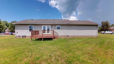 Rear view with deck for your cookouts! Huge backyard for fall and winter fun!