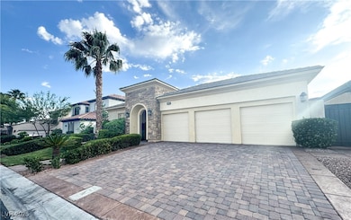 View of front of home featuring stone siding, deco