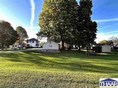 Huge back yard with shade trees and detached 3 car