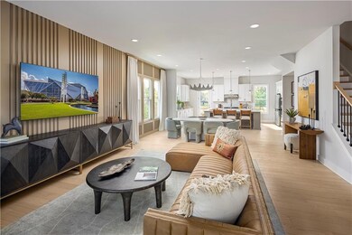 Living room with light wood-type flooring and a he