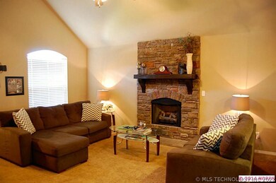 Spacious living room with vaulted ceiling.