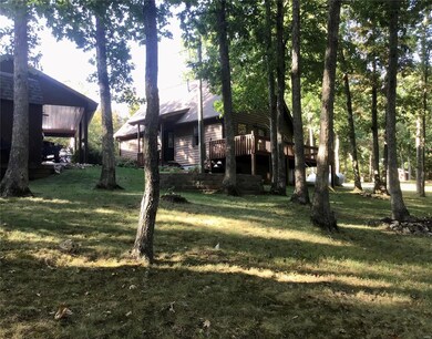 Large Back Yard Sloping To Woods