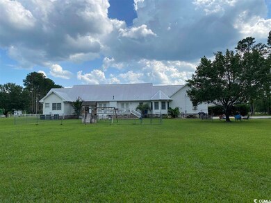 Single story home with a front lawn