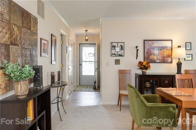Entryway into foyer that leads to dining room