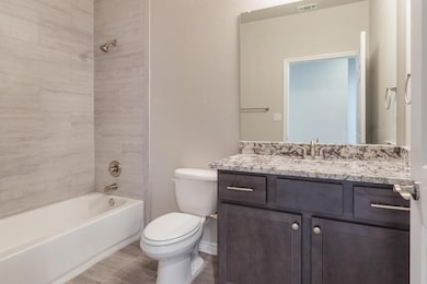 Full bath with vanity, toilet, and bathing tub / 