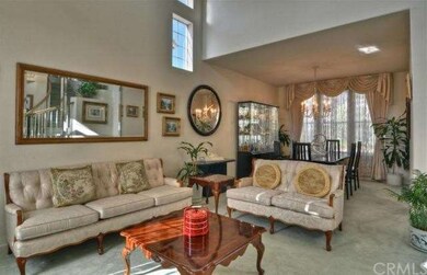 Elegant Living Room with soaring ceilings and open