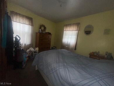 Bedroom featuring multiple windows