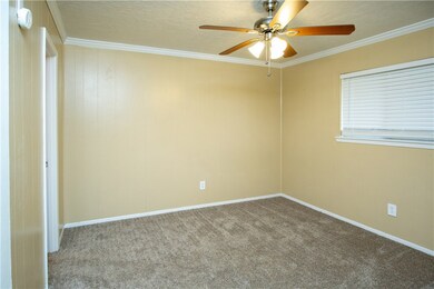 Spare room featuring ceiling fan, carpet flooring,