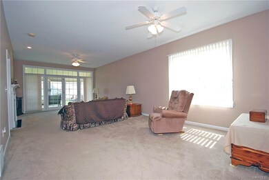 Living room dining room combination. Doors to sun 