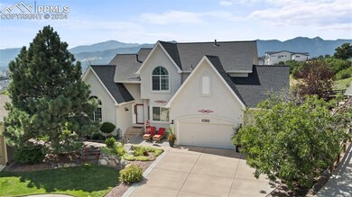 Front of property featuring a front yard, a mounta