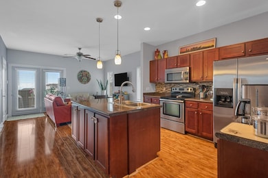 The kitchen has stainless steel appliances with the fridge remaining.
