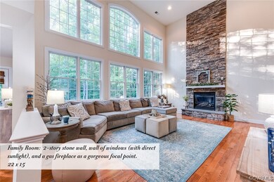 Family Room -  2-story stone wall, wall of windows