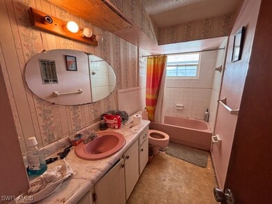 Full bathroom featuring shower / tub combo with cu