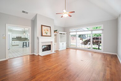 This room has tall architectural ceilings with bui