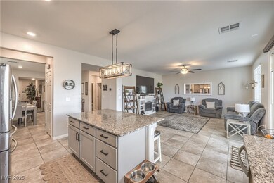 Kitchen with gray cabinets, a ceiling fan, freesta