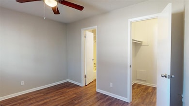 Unfurnished bedroom featuring a closet, baseboards