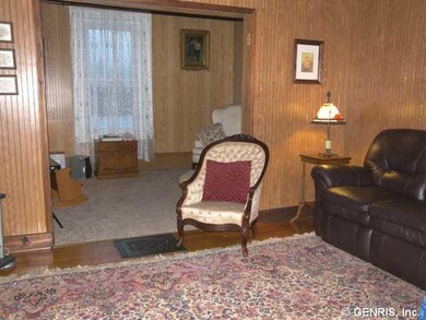 Family Room Warm, cozy family room with den beyond