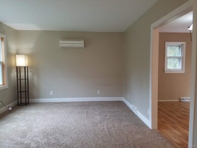Living room opening up to kitchen (dividing wall i