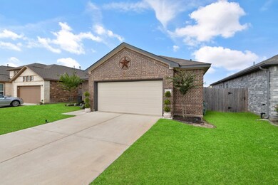 A double-wide driveway leads to the 2-car attached garage, complete with an automatic garage door opener, for plenty of convenient parking.