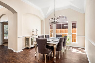 As you enter the home, the office is to the left behind French doors, and the dining room is just beyond that.