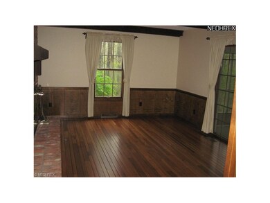 Family Room with Beamed Ceiling, Hardwood Flooring